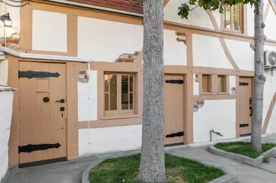 a building with a door and a tree at The Magic Castle (Unit5) - Six Flags in Newhall
