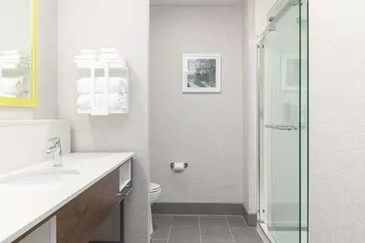 a white bathroom with a toilet and a shower at Hampton Inn & Suites Porter Ranch Los Angeles in Deer Lake Highlands