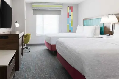 a hotel room with two beds and a flat screen tv at Hampton Inn & Suites Porter Ranch Los Angeles in Deer Lake Highlands