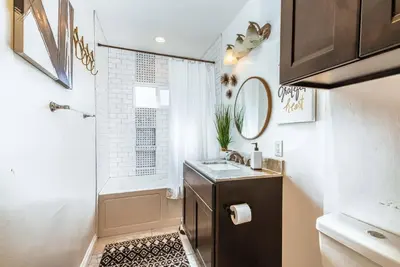 a bathroom with a sink and a shower at Coastal Retreat With a minimum stay of 30 days in Lakewood