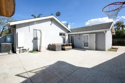 a house with a basketball hoop in the backyard at Beautiful Spacious Home in Los Angeles