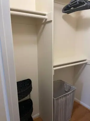 a closet with a white refrigerator and a trash can at Luxury 2 bedroom apartment in downtown LA! in Los Angeles