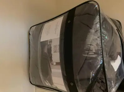 a suitcase that is wrapped in plastic on a wall at Luxury 2 bedroom apartment in downtown LA! in Los Angeles