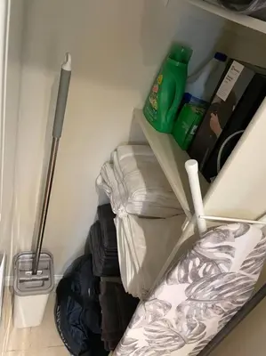 a room with a closet with clothes and a broom at Luxury 2 bedroom apartment in downtown LA! in Los Angeles