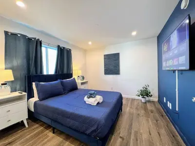 a bedroom with a bed with a stuffed animal on it at Trendy 2BR Near Hollywood Hotspots - BR9 in Los Angeles