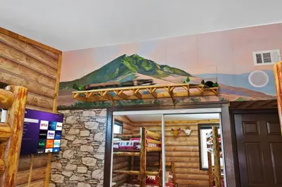 a room with a mountain mural on the wall at Great Outdoors by OC Adventure Homes in Garden Grove