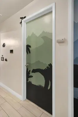 a door with a painting of a wolf on the wall at Dino Disneyland by OC Adventure Homes in Garden Grove