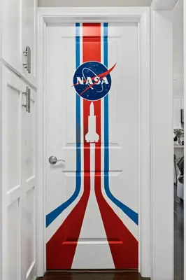 a door with an american flag painted on it at Galaxy Quest by OC Adventure Homes in Garden Grove