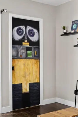 a door with a face painted on it in a room at Galaxy Quest by OC Adventure Homes in Garden Grove