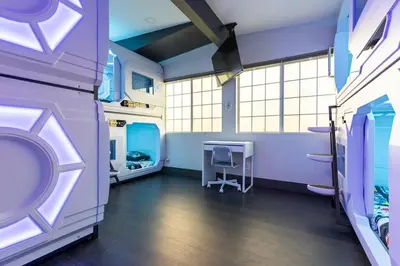 a room with purple walls and a table and chairs at Galactic Dream by OC Adventure Homes in Garden Grove