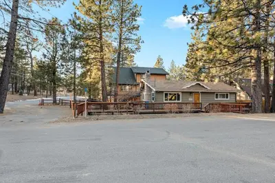 a house in the middle of a forest at Green Pines Lake Retreat Walk to Lake in Big Bear Lake