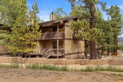 a home with a large house with a tree at NEW Summit Lookout in Big Bear Lake