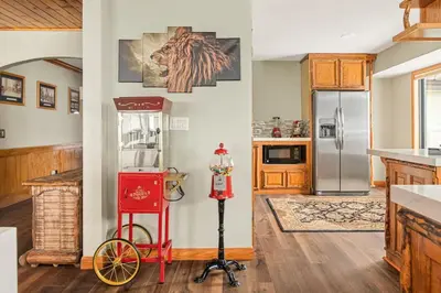 a kitchen with a red bike in a room at Roaring Lion Lakefront Lodge in Big Bear Lake
