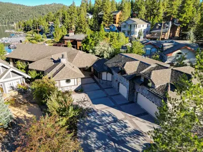 an aerial view of a house with a yard at Roaring Lion Lakefront Lodge in Big Bear Lake