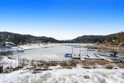a frozen river with snow on the ground at Roaring Lion Lakefront Lodge in Big Bear Lake