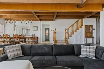 a living room with a couch and a dining room at HoneyBear Lodge Lakefront in Big Bear Lake