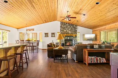 a living room with a couch and a fireplace at Fallen Leaf Hideaway Castle Estate in Big Bear Lake