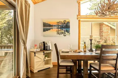 a dining room with a table and chairs at Zen Mountain Retreat in Big Bear Lake