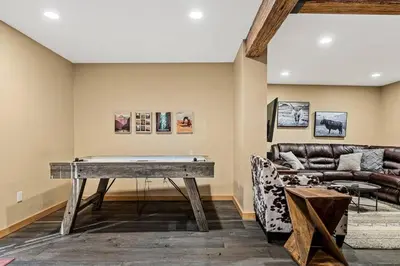 a living room with a table and a couch at The Great Escape in Big Bear Lake