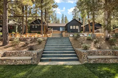 a set of stairs leading up to a house at Lakefront View Stunner in Big Bear Lake