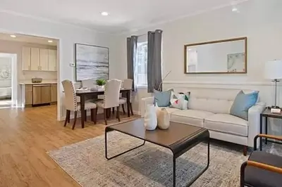 a living room with a couch and a table at Spacious 3Bdr Home close to Manhattan Beach in Lawndale