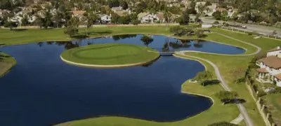 an aerial view of a golf course with a lake at Spacious 3Bdr Home close to Manhattan Beach in Lawndale