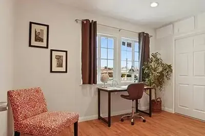 a room with a desk and a chair and a window at Spacious 3Bdr Home close to Manhattan Beach in Lawndale