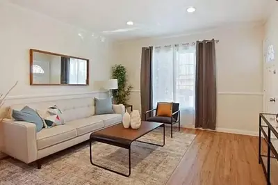 a living room with a couch and a table at Spacious 3Bdr Home close to Manhattan Beach in Lawndale