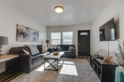 a living room with a couch and a table at Van Nuys Abode with Patio, 7 Mi to Universal Studios in Van Nuys