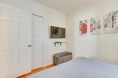 a bedroom with a bed and a tv on a wall at North Hollywood Getaway 14 Mi to Downtown! in North Hollywood