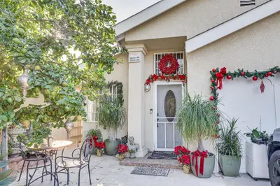 a house with christmas decorations on the front door at Los Angeles Apartment with Patio, 4 Mi to Downtown! in Los Angeles