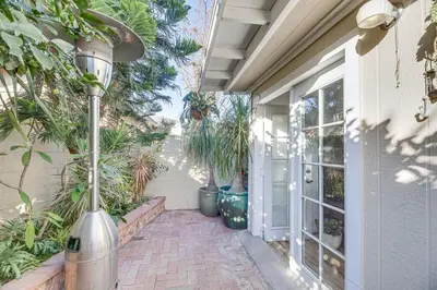a porch with potted plants and a street light at Los Angeles Apartment with Patio, 4 Mi to Downtown! in Los Angeles