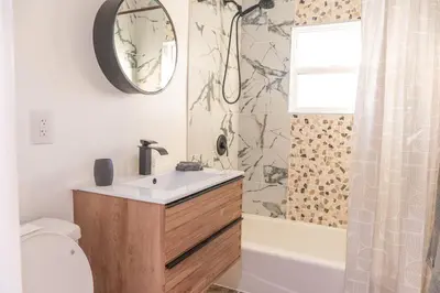 a bathroom with a sink and a toilet and a shower at Beautiful hillside gateway in Los Angeles