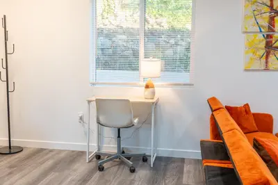 a desk in a room with a chair and a window at Beautiful hillside gateway in Los Angeles
