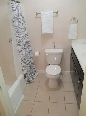 a bathroom with a toilet and a shower curtain at 4 Bedrooms & 2.5 Bathrooms in LA in Los Angeles