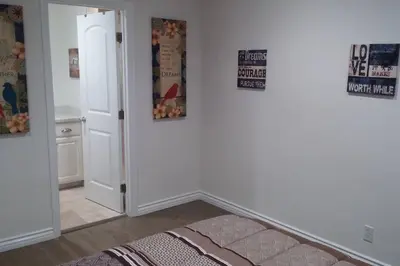 a room with a hallway with a door and a rug at Family getaway 3 BR 2 Bath home in Lomita, CA. in Los Angeles