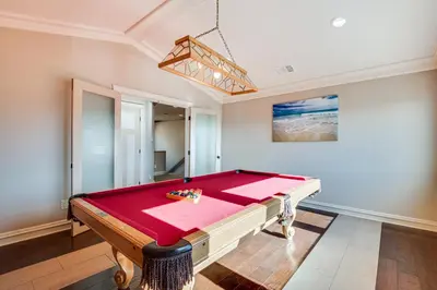 a pool table in the middle of a room at Expansive Mountain Gem Game Room, 3 Mi to Acton in Ravenna