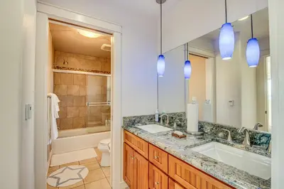 a bathroom with a sink and a toilet and a tub at Expansive Mountain Gem Game Room, 3 Mi to Acton in Ravenna