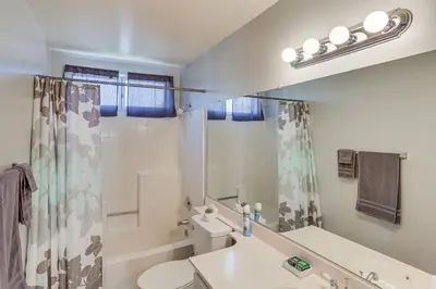 a bathroom with a sink and a toilet and a shower at Victorville Home with Fenced Backyard and Patio! in Victorville
