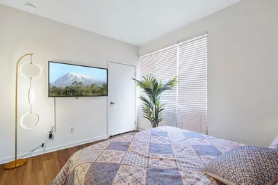 a bedroom with a bed and a view of a mountain at 2 Santa Monica Beach Walking in Los Angeles