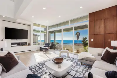 a living room with a view of the ocean at Malibu Breeze - hot tub, ocean view, steps to beach in Malibu