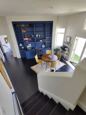 a dining room with a table and chairs in a room at Epic Views! Hollywood Hills SkyVilla: Crow's Nest in Los Angeles