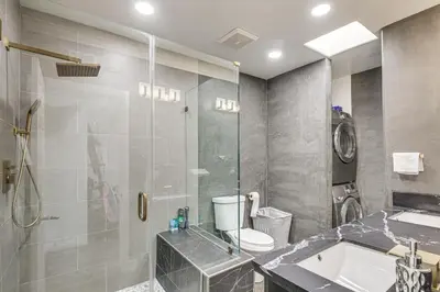 a bathroom with a shower and a toilet and a sink at Los Angeles Townhome Off-Street Parking and Balcony in Los Angeles