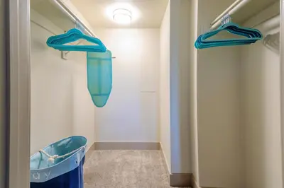 a walk in shower with blue hoses in a room at Sunny Living l Walk to the Marina in Los Angeles