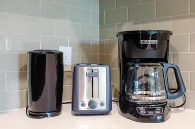 two coffeemakers sitting on a counter next to each other at Sunny Living l Walk to the Marina in Los Angeles