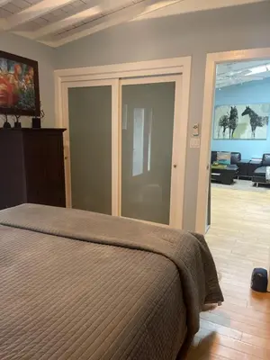 a bedroom with a bed and a living room at Malibu Ranch Guest House Hideway in Malibu
