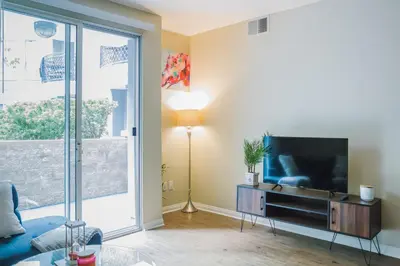 a living room with a large flat screen tv at Charming & Peaceful l 1 bedroom in Marina Del Rey, CA in Los Angeles