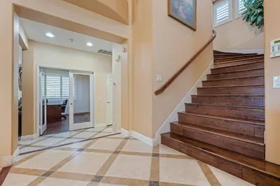 a hallway with stairs in a home at ৎ୭The safty paradiseৎ୭ H/w Pool Jacuzzi &much more in Los Angeles
