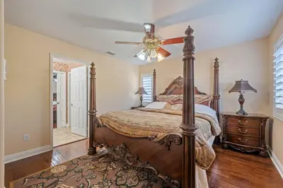 a bedroom with a bed and a ceiling fan at ৎ୭The safty paradiseৎ୭ H/w Pool Jacuzzi &much more in Los Angeles