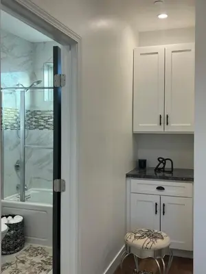 a bathroom with a tub and a shower and a stool at The Verna Mae in Los Angeles